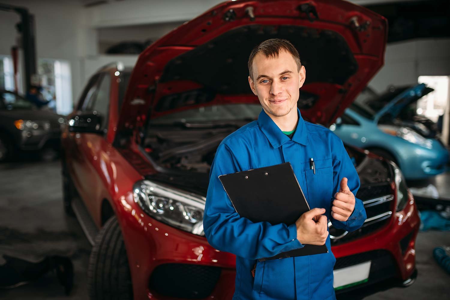 technician-with-notebook-car-with-opened-hood-small.jpg technician-with-notebook-car-with-opened-hood-small.jpg